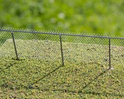 Build an easy to make do-it yourself metal cyclone fence in HO Scale